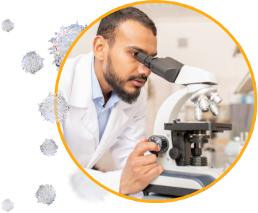 cancer researcher looking through a microscope